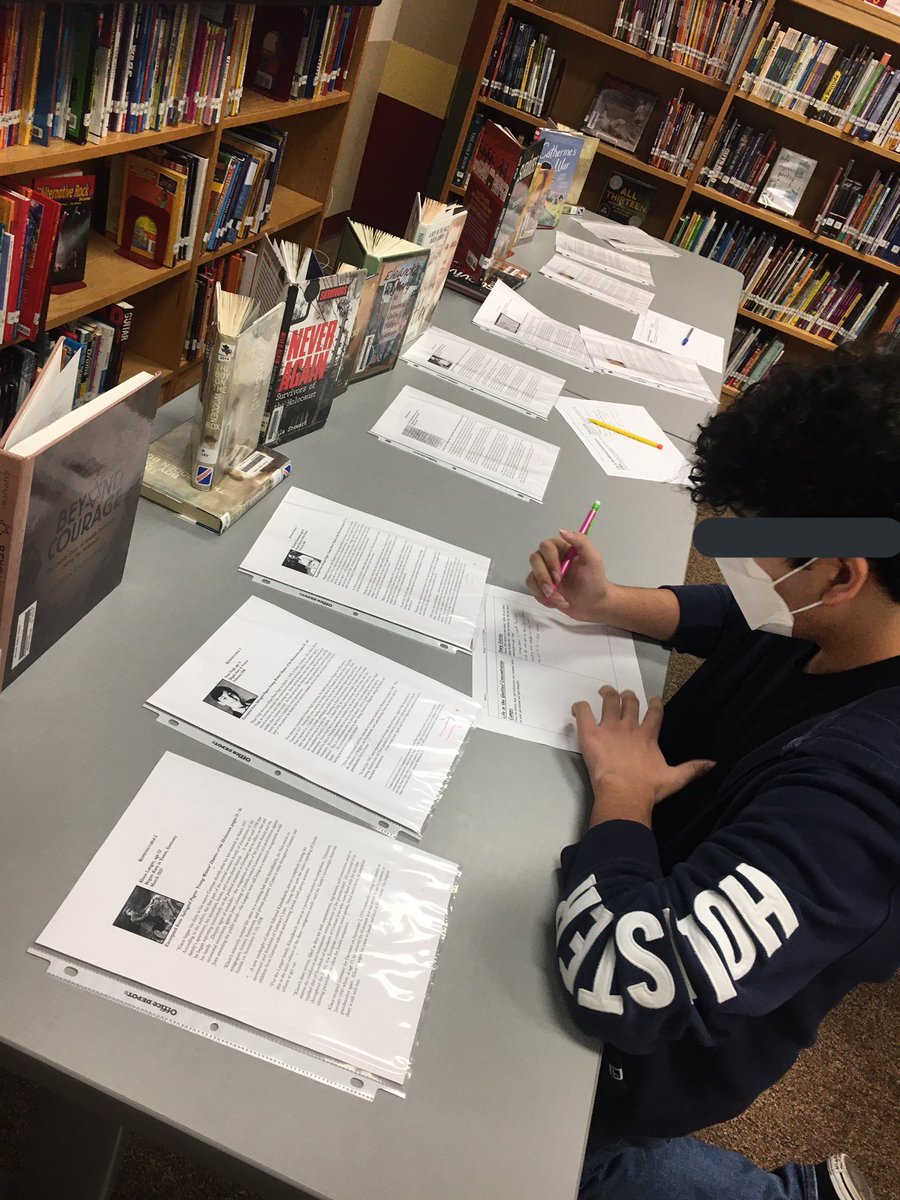 LibraryBriscoe's tweet photo. Our library has turned into a museum for the week. 8th grade is coming down to check out stations about Holocaust to learn about the atrocities that happened, hear from those who experienced it, and learn about propaganda. @NISDBriscoe @NISDLib @QueenB_ela https://t.co/0ej4Dy6pTL