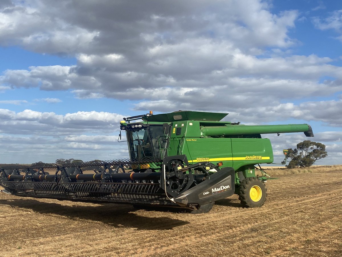 John Deere header with macdon 40ft front chillin like a villain at robinvale if you need a hand call David 0431702615