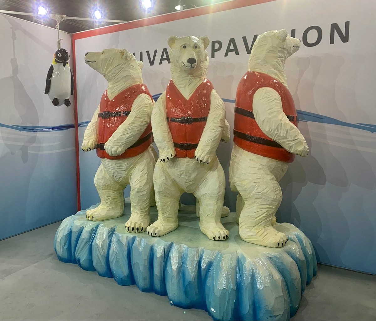 maxinejoselow's tweet photo. Tuvalu’s pavilion at #COP26 features an art installation of polar bears wearing life vests and a penguin with a noose around its neck.
The artist, Vincent Huang, told me it’s a metaphor for the people of Tuvalu, who have emitted little CO2 but are threatened by sea-level rise. https://t.co/9ZdpdSSRgD