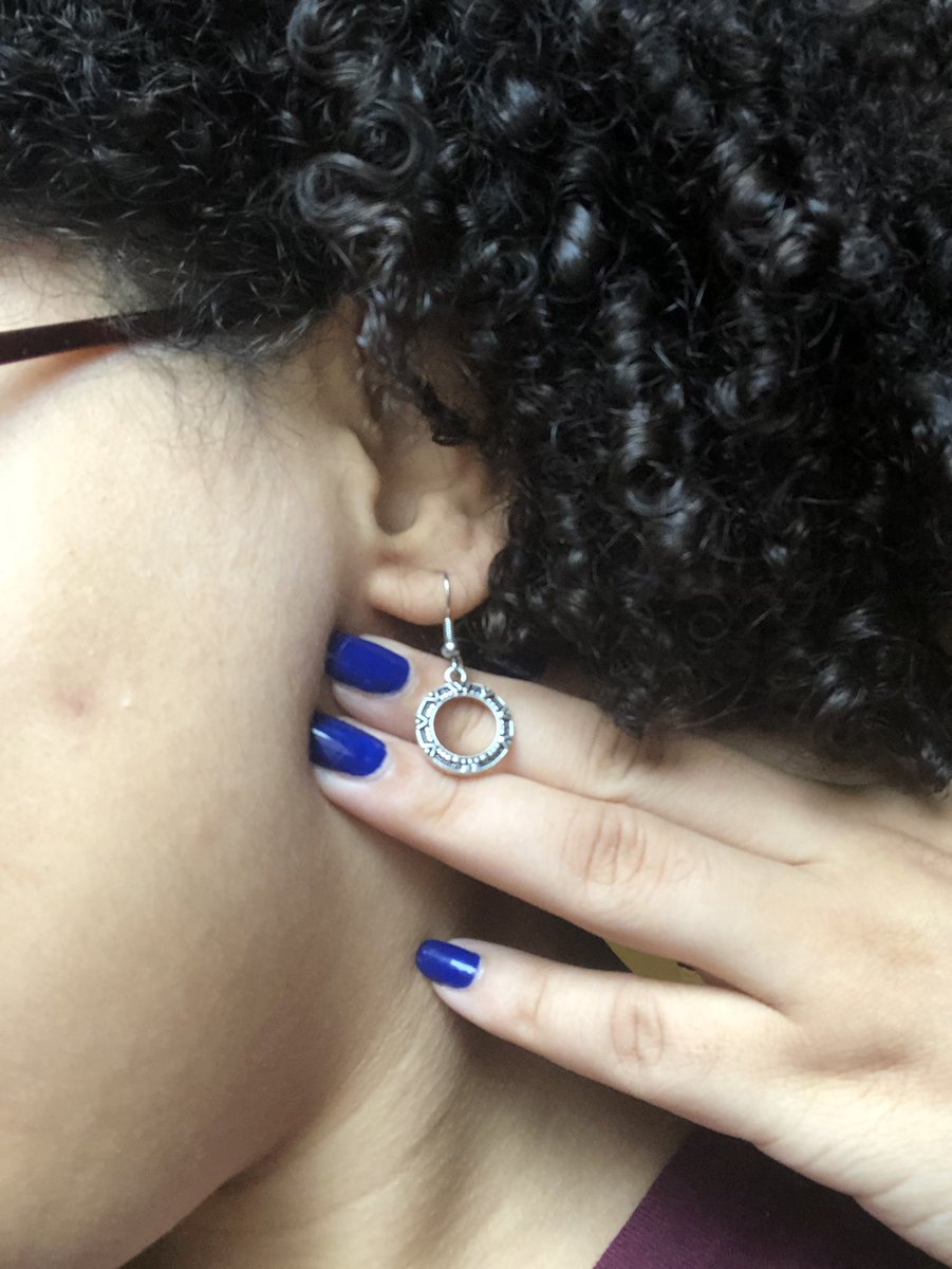 Closeup photo of my earring shaped like the stargate.