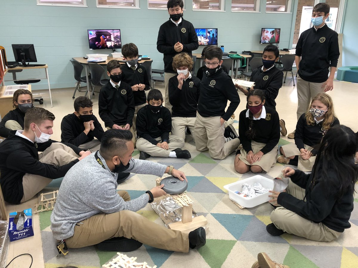 STSTigers's tweet photo. @STSTigers 8th graders have been designing and building bridges from popsicle sticks for several weeks in #STEM class. Today was the final test - which bridge could hold the most weight. They were enthralled!  #popsiclebridgecompetition #futureengineers @arlingtonOCS https://t.co/r351I5k9jK