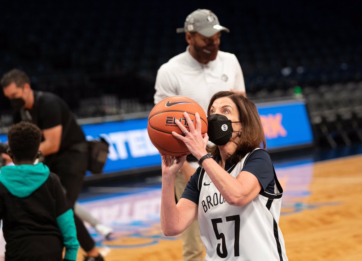 Governor Hochul prepares to shoot basketball
