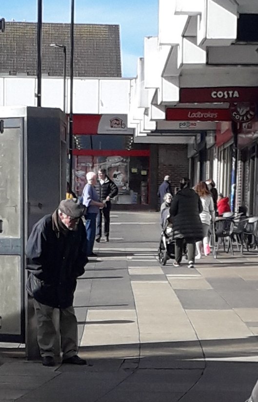 GraemeTiffany's tweet photo. What happens when there's no public seating; this old kid having to lean against a telephone box to have a breather #StandUpForAPlaceToSit https://t.co/d7pquhirRt