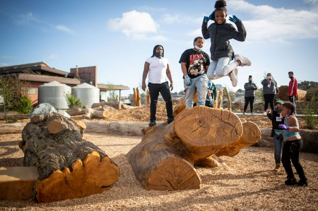 RecParkSF's tweet image. Children scrambled over boulders, crawled into a kid-sized tunnel in a hollow tree, and perched atop repurposed logs yesterday following a ribbon cutting at the city’s Nature Exploration Area at Heron’s Head Park!