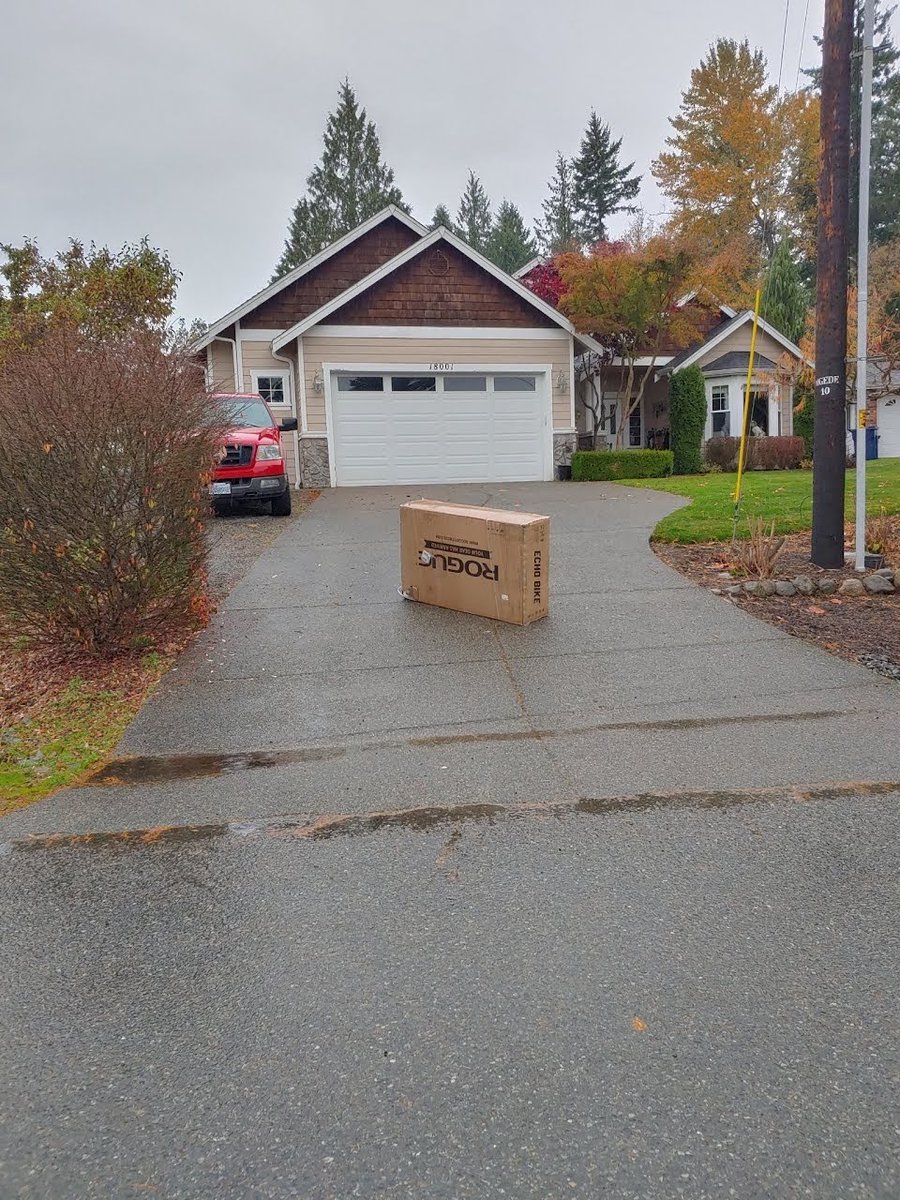 rudyshoe's tweet photo. Really @UPS? This is how you're delivering packages now? Just dump them in the driveway in the pouring rain? WTF?!?! https://t.co/DAwMarWMQ1