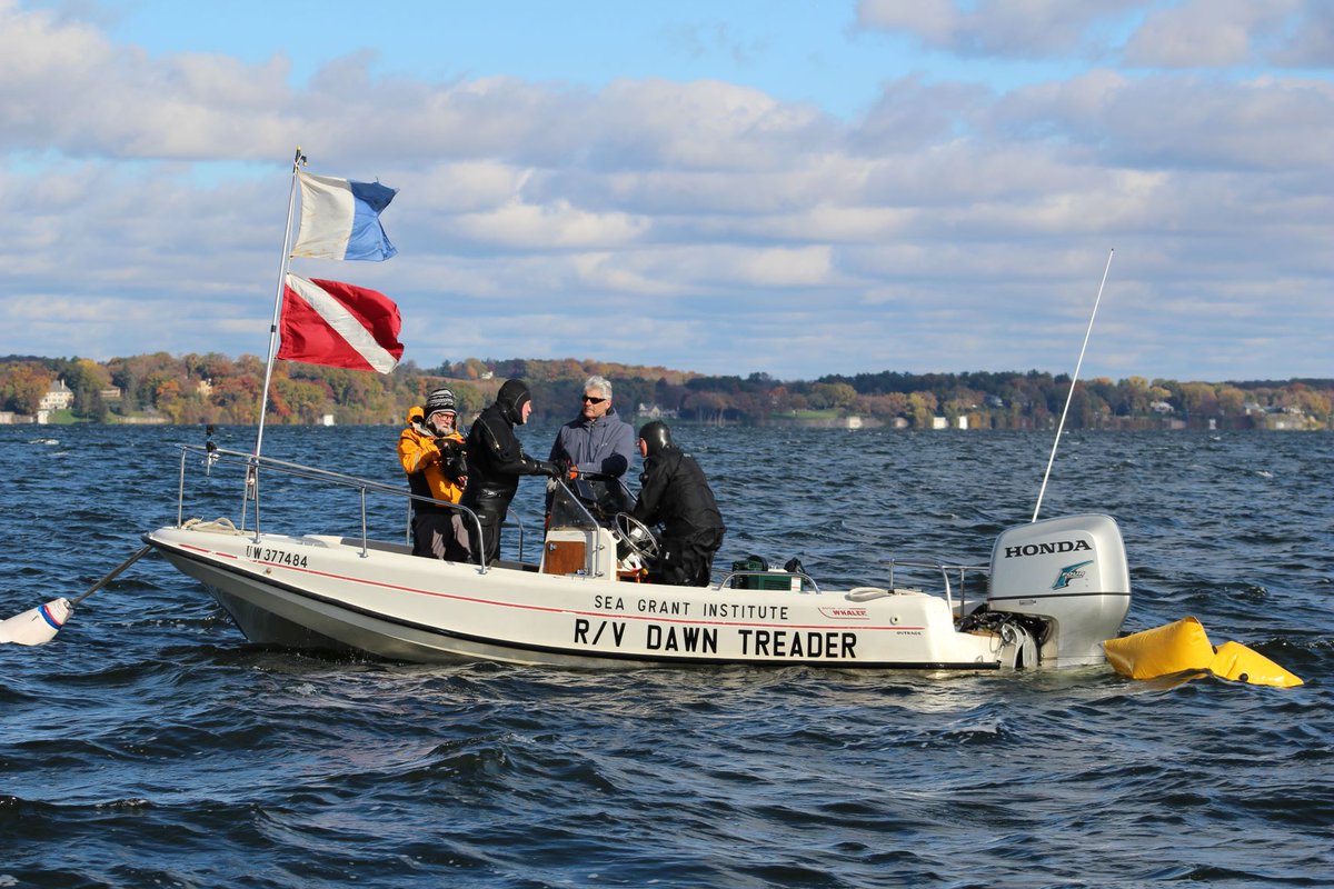 WisHistory's tweet photo. HISTORIC MOMENT: @WisHistory maritime archaeologists recovered historic dugout wood canoe from bottom of Lake Mendota today, just few months after learning of its existence in June 2021. Carbon dating indicates that vessel is approximately 1,200 years old. #WisconsinHistory https://t.co/FNRq3OjSwS