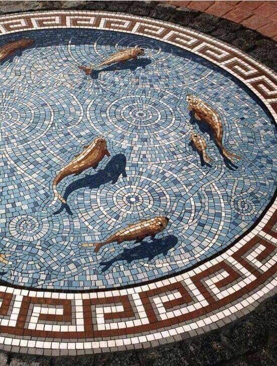 A highly used example of shadows in a mosaic, Gary Drostle's Koi Fish mosaic "Fishpond" used both types with a striking effect. Shadows in this design are used to give fish shape and realism, while 'shadow shadows' are used to connect them to the lake.
