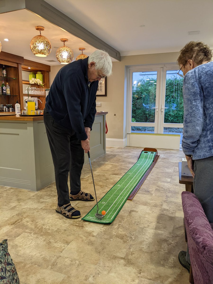 PineMartinCare's tweet photo. The putting matt was back out again this week. Our ladies and gentlemen have really enjoyed using it and keep asking for another go so it has become a regular activity. I think they are secretly practising for the Ryder Cup..! https://t.co/aL5GmNmJhm