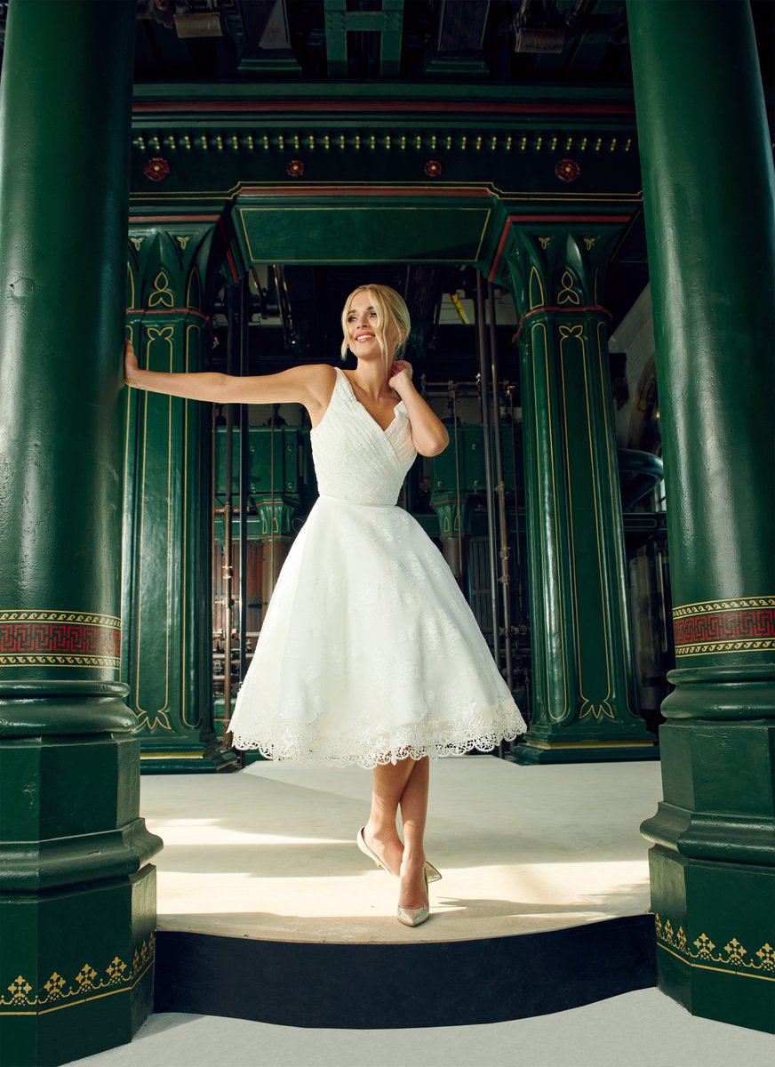 SO... here we go with the new House of Mooshki  2022 collection. Introducing Annie..... a gloriously fun ivory short tea length wedding dress overlaid in fabulous lace with a trim to the hem. Cross over bodice with a V neckline which is great for curvier brides.