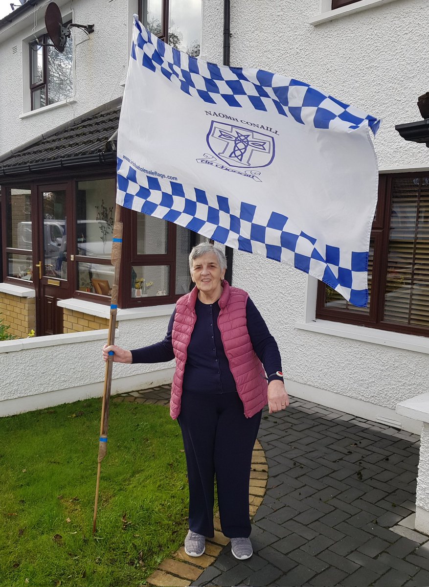 NaomhConaillGAA's tweet photo. Maureen McGuinness in top form under the big blue &amp; white Naomh Conaill flag outside her home in Ardpatrick!
Maureen is looking forward to Sunday's county final and wishes her grandson Charles, the team &amp; management all the best for the match!
#family #community #NC100Years https://t.co/lKQsZ6kc9L