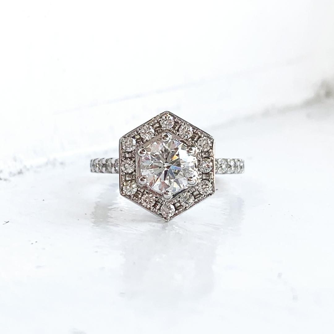 DanasGoldsmith's tweet photo. A refresh of her original engagement ring gives way to this elegant and open gallery design.  The new hexagonal halo features diamonds from her wedding band, a new page in her story.  Let us tell YOUR story.

#designsatdanas #customdesign #customjewellery https://t.co/mTlq3qkp2g
