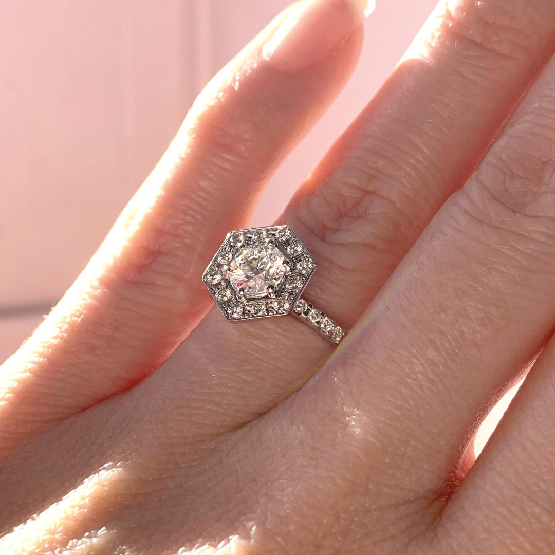 DanasGoldsmith's tweet photo. A refresh of her original engagement ring gives way to this elegant and open gallery design.  The new hexagonal halo features diamonds from her wedding band, a new page in her story.  Let us tell YOUR story.

#designsatdanas #customdesign #customjewellery https://t.co/mTlq3qkp2g