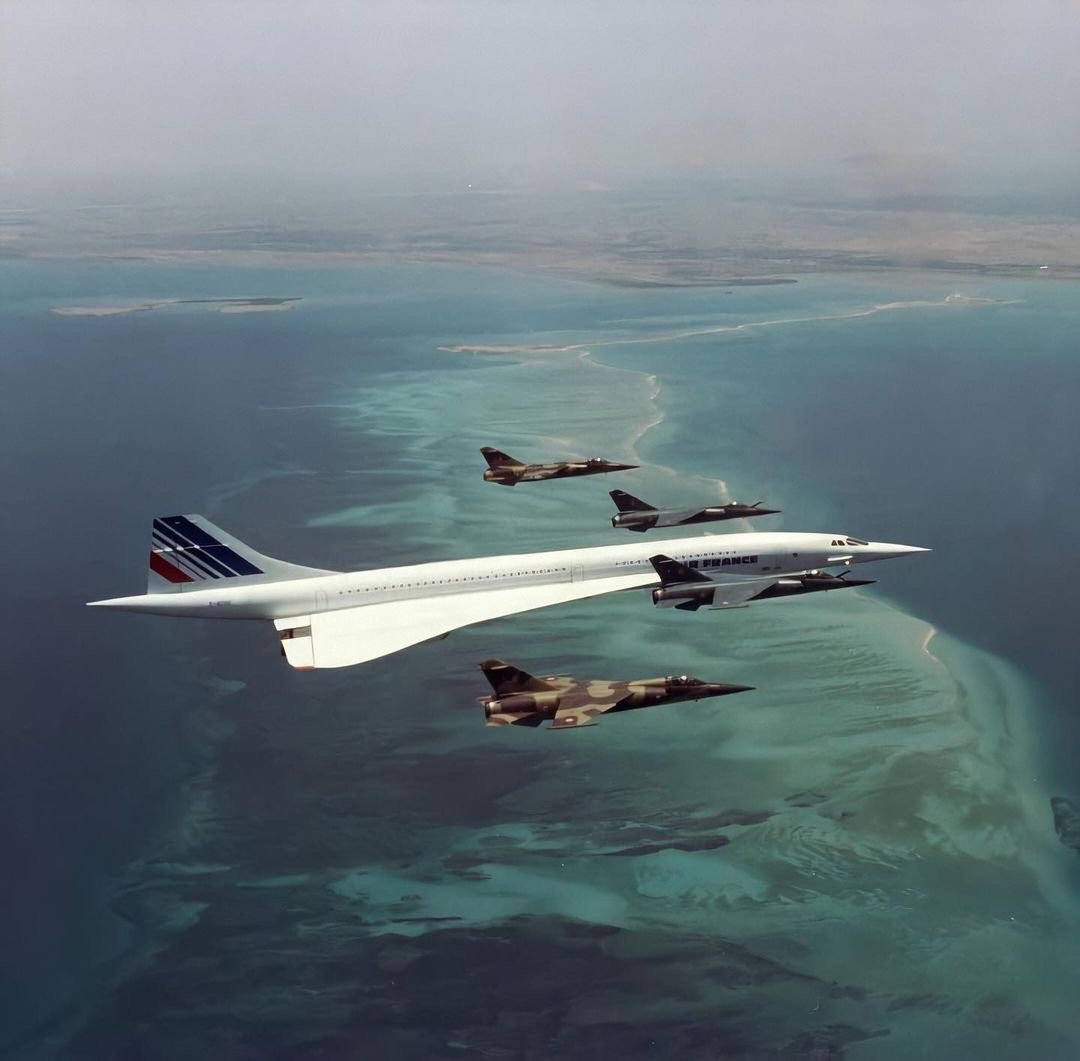 rhgents's tweet photo. Flying into the weekend in style, just like this incredible image of the Air France Concorde being escorted by French Air Force fighter jets for the president of France at the time in 1989. https://t.co/emRlB8SlrG