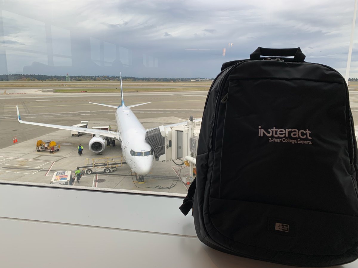 interact's tweet photo. The Interact team is back on the road again, repping our super cool Interact swag. Shout out to our Director of Communications, Grace, for capturing this at the Seattle airport. #InteractLife https://t.co/xppkAYDv7o