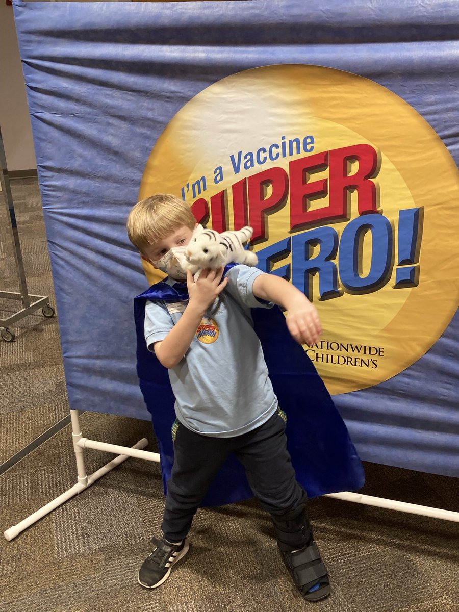 Exciting day. I got my COVID-19 booster and my 7 year old got his first COVID-19 vaccine. And he even got a cape! 💉😎 #vaccinehero