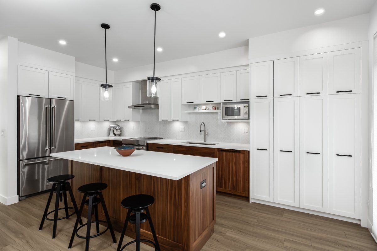 White and walnut - a winning combination.
Home renovation by Alair Homes White Rock.