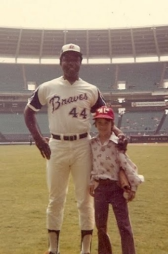 I'm still trying to figure out why I wore a purple butterfly shirt to get my picture with my childhood hero,  Hammering Hank Aaron.  It was the 70's, but still.... beyond comprehension.