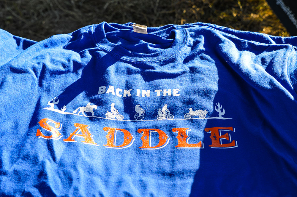 DRCOGorg's tweet photo. Did you buy merch from the 2021 Bike to Work Day event in September? Shout-out to @GdbyBlueMonday for hosting the sales of "Back in the Saddle" swag! Thanks to our sponsors for making the annual Bike to Work Day possible! #DRCOG #BTWD2021 #BTWD #WayToGo #WayToGoDenver https://t.co/KSpRW26Abx