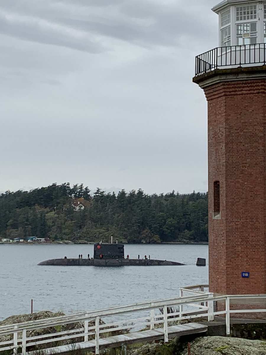 AngusTopshee's tweet photo. Adorned with a poppy #HMCSVictoria passes #BickfordTower and @FortRoddFisgard to head to sea for local force generation (training and trials)

#CanadaRemembers https://t.co/QSiz3eSpgy