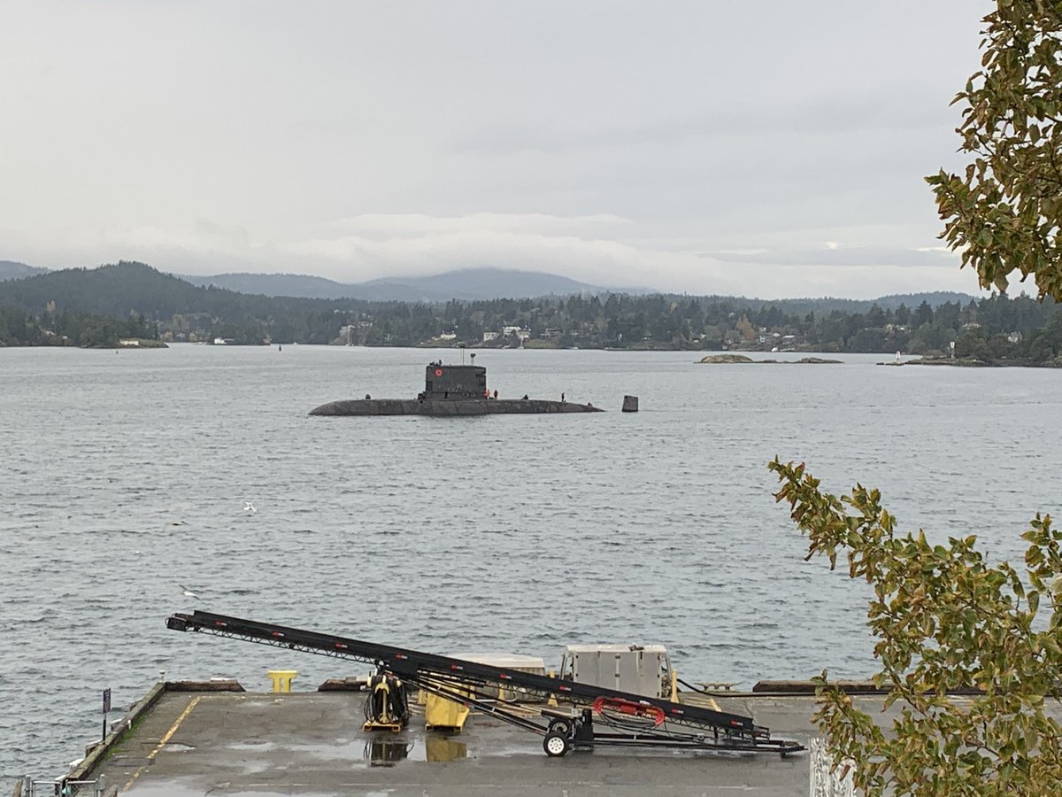 AngusTopshee's tweet photo. Adorned with a poppy #HMCSVictoria passes #BickfordTower and @FortRoddFisgard to head to sea for local force generation (training and trials)

#CanadaRemembers https://t.co/QSiz3eSpgy