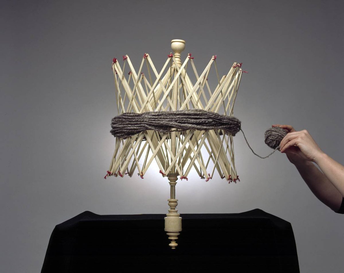 seamuseum_'s tweet photo. This whalebone swift used by crocheters and knitters supports a skein of yarn while being wound into a ball. The complex construction of flat and turned parts made with fine tolerances, so it turns smoothly, fascinates our Conservator Alayne. #AskAConservator  
📷 Andrew Frolows https://t.co/VDGjk0APZk