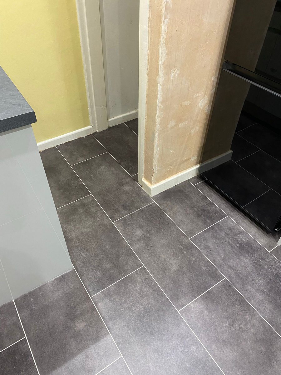 Tile effect luxury vinyl supplied and fitted to a kitchen complete with ice grouting strips. This product is warm underfoot, non slip, easy to maintain- and it looks amazing. Call for a free quotation 01244 291900. #happycustomer #luxuryvinylspecialists #chestertweets