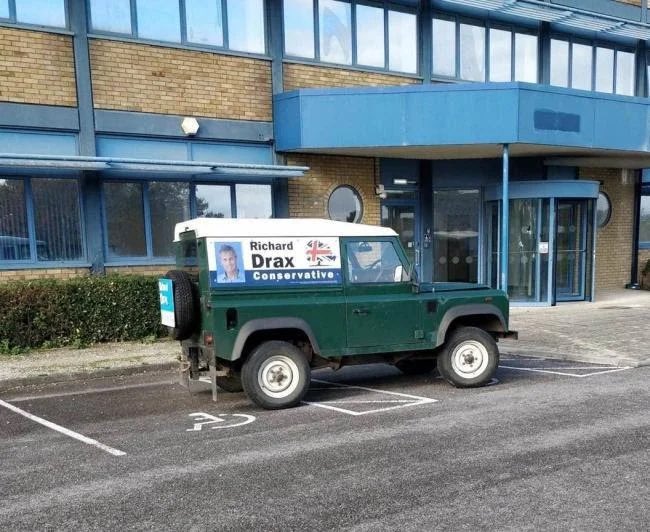 BrexitBuster's tweet photo. If ever a single photograph captured Tory arrogance, selfishness and entitlement it’s this one where Dorset Tory MP Richard Drax parked his fuel-guzzling election campaign vehicle right across two disabled parking bays. He’s admitted he was driving. 😡 #TorySleaze #ToriesOut https://t.co/Ge1QyDkme6