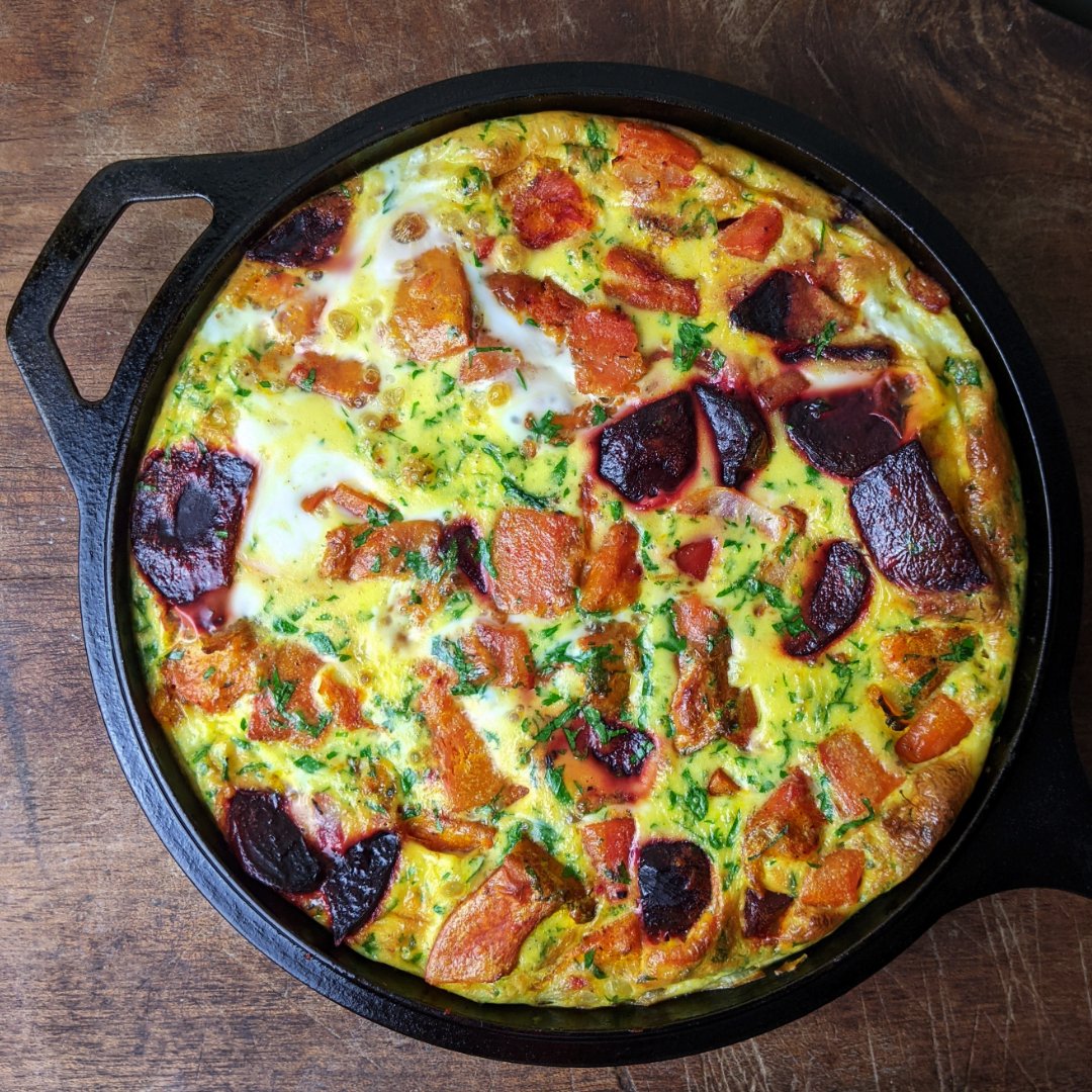 Had a load of roasted pumpkin, beetroot &amp; carrot left over, so chucked them into a frittata with sauteed onion and garlic, eggs, double cream, lots of chopped parsley and plenty of seasoning. It's not often that a fridge clearing exercise is quite so pretty and delicious!