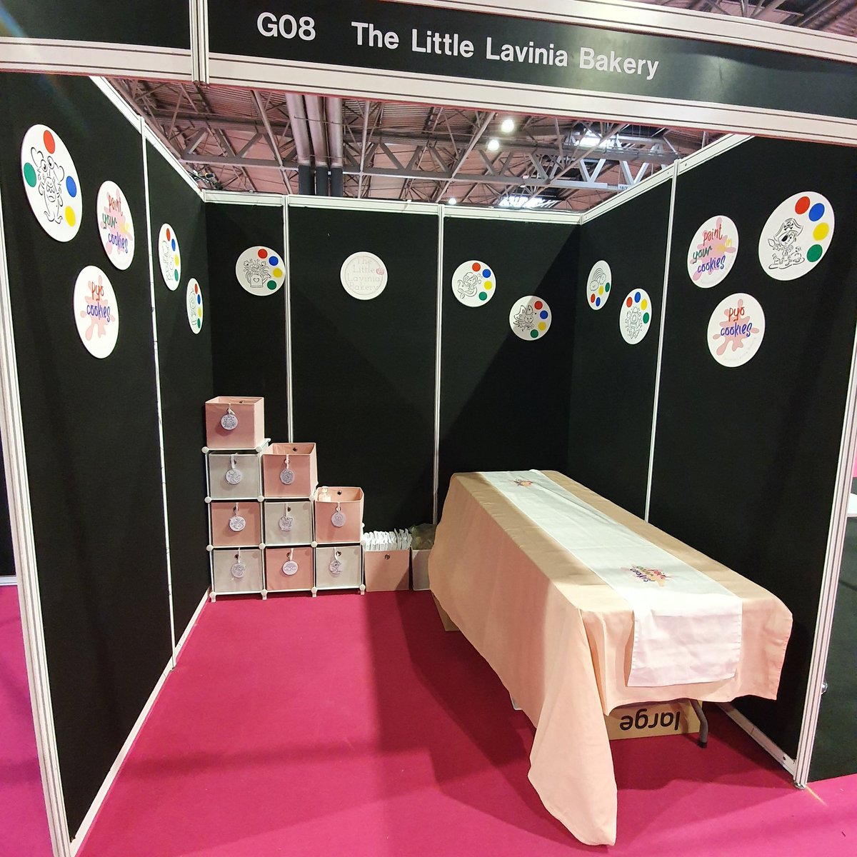 LaviniaBakery's tweet photo. All set up and ready for the weekend! Just need to borrow something to hide that box! 🤦‍♀️
So excited to be at @thecakeshows with my Paint Your Own Cookies! And I've got the best helper with me too!
Stand G08 if you're popping by! #cakeinternational #Birmingham #NEC #girlsweekend https://t.co/RMcVxCyRPh