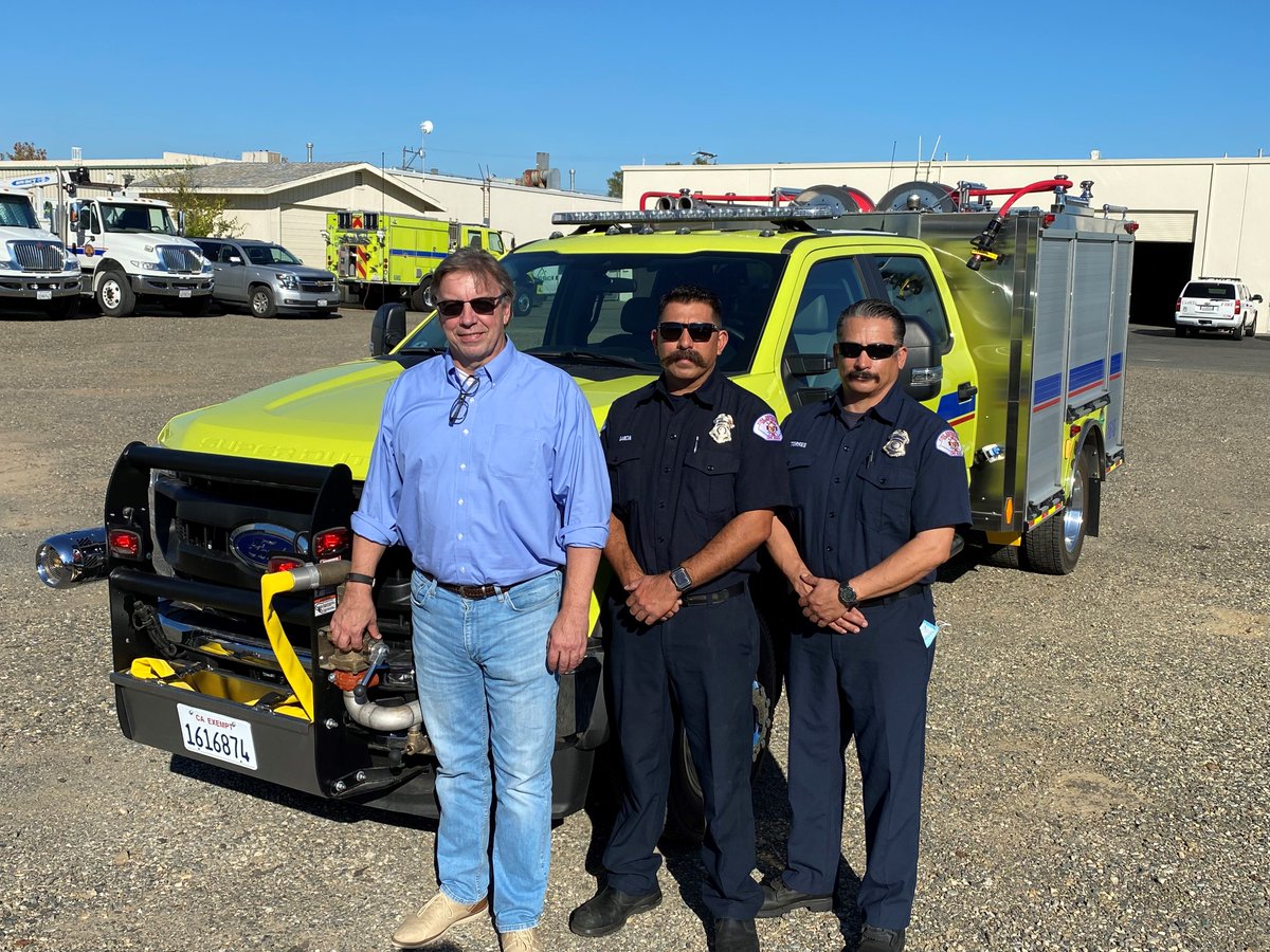 Engineer Daniel Torres and Engineer Ruben Garcia of the Long Beach (CA) Fire Dept. stand proudly before an HME Ahrens-Fox Type 6 Wildland truck assigned to their department through cal oes. Ed Boring, HME Fleet Sales Manager, was there to commemorate the delivery.