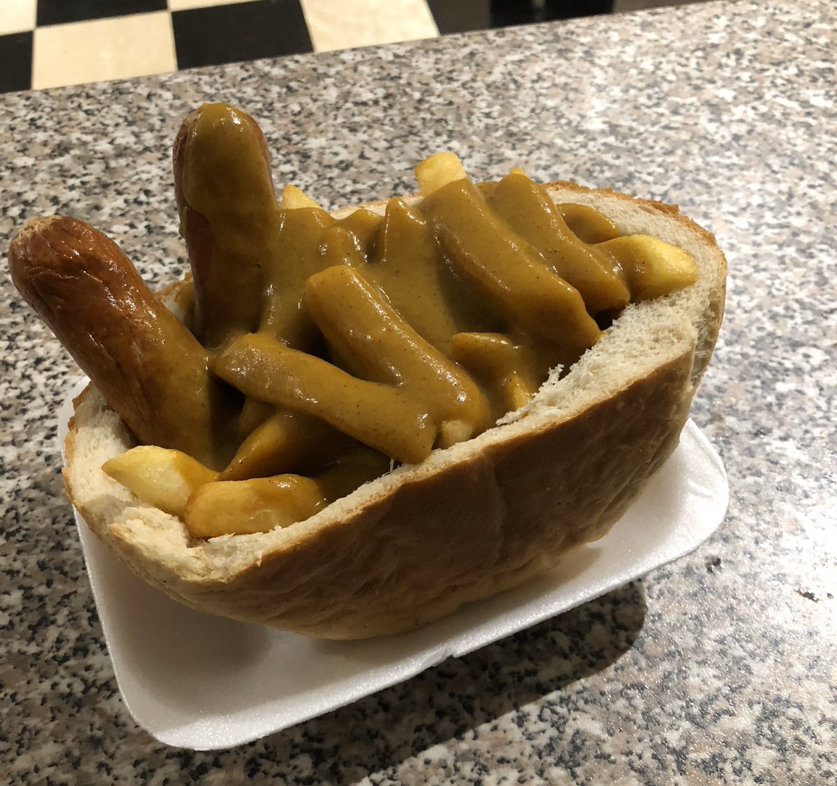 Sausage and chips with curry sauce in a cob at Merthyr Town (<a href="/MerthyrTownFC/">The Martyrs</a>)