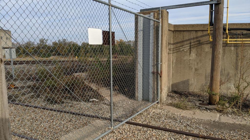 AffinisCorp's tweet photo. Let's talk about levee safety! The current solution is a rail spur closure, using timber stop-logs. How would you prep this area for flooding? #engineering #movingcommunitiesforward #InfrastructureMatters https://t.co/efZtS2ZT9u