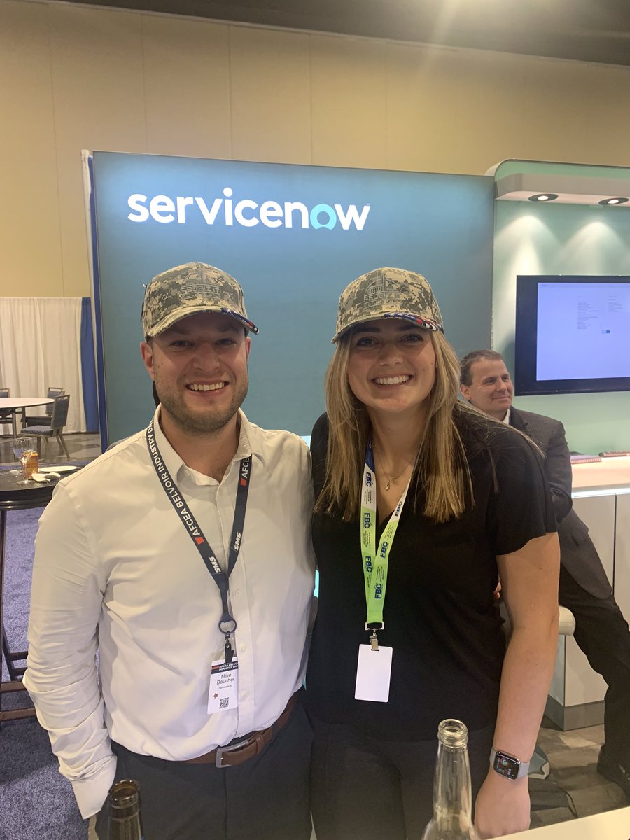 FedBizIT's tweet photo. Our friends at @servicenow sporting our hats! (Can you spot our logo? 🔍) We are glad to have such great partners like them. #AFCEA #Belvoir2021  #Belvoir2021 https://t.co/t1VnCpFtaP