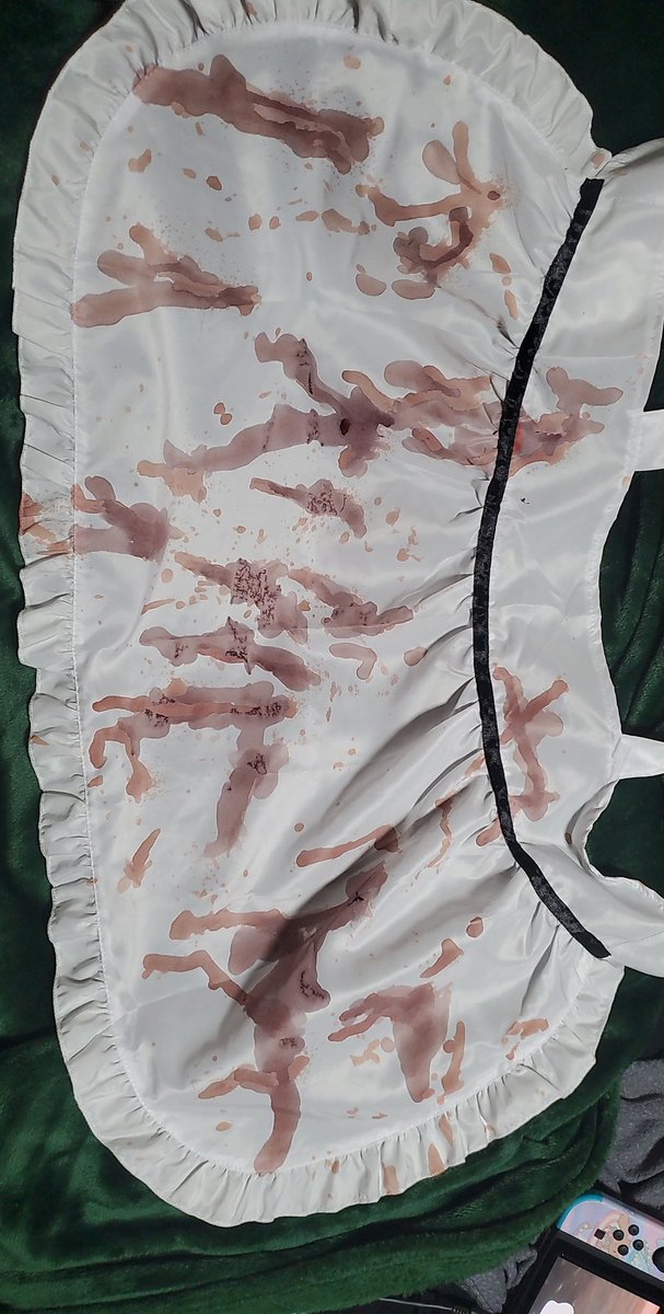 🎤Hey uh anyone that does cosplay?? Please help??

I tried fake blood spray on my maid apron and it dried like this
Is there ANYTHING I CAn do to fix this or should i forget about my cosplay for the con?