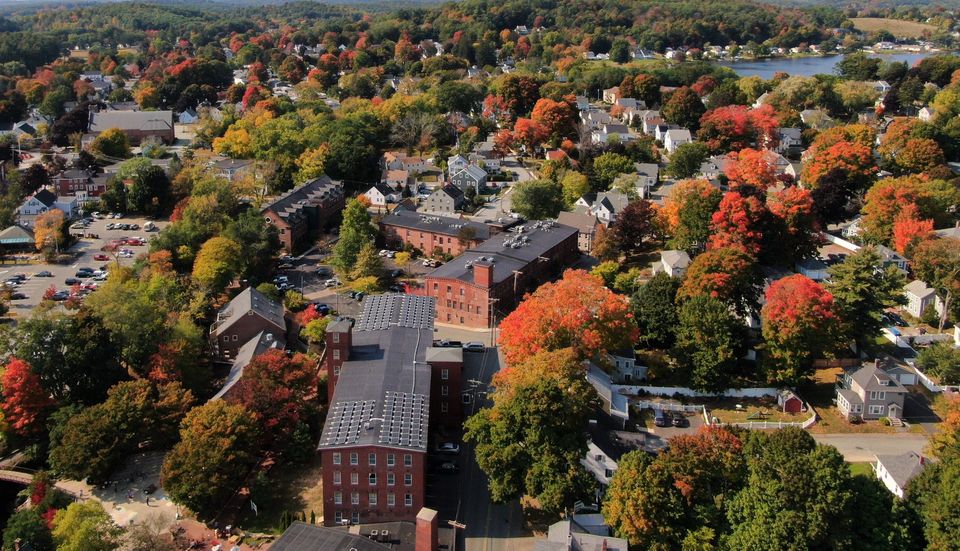 Gorgeous aerial shot of Amesbury's mill buildings at the start of fall. 📷: Wendy Bush #AmesburyMA