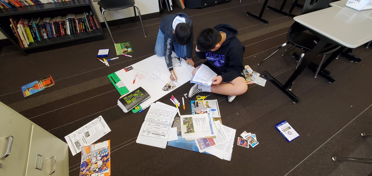 7th graders immersed with hands-on text features practice! #teamwork #BetterTogether