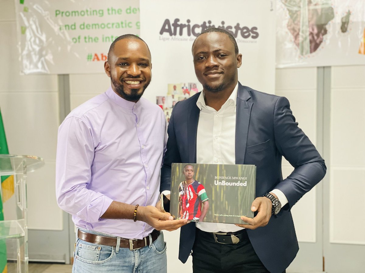 bonifacemwangi's tweet photo. On the sidelines of @AFRICTIVISTES conference,
I’m selling my book #BMunBounded to delegates. Thank you @nnenna and @Simeon_5 for buying a copy of my book. #Abidjan2021 https://t.co/vJQU0jZnHU