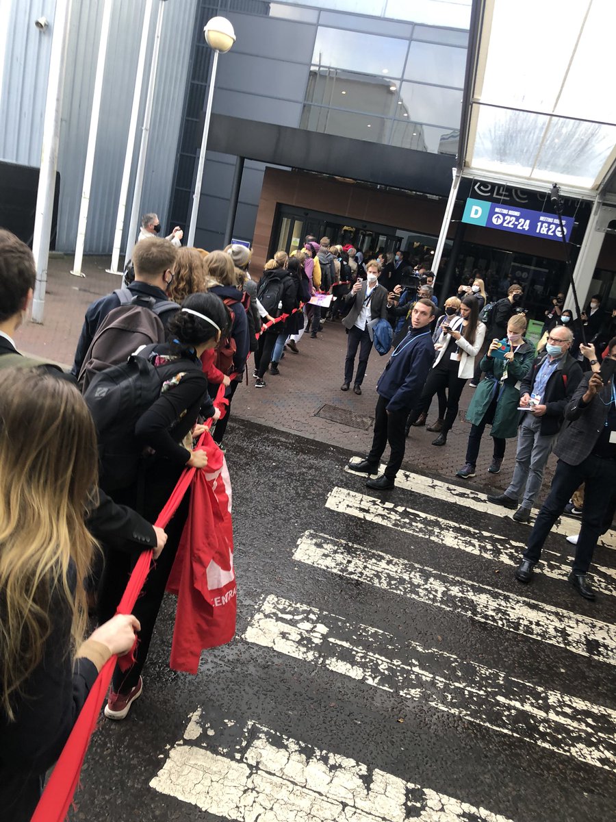 OliHenman's tweet photo. March of #solidarity after #PeoplesPlenary through #COP26 ‘What do we want?’ #ClimateJusticeNow #FacesFromTheFrontlines https://t.co/IfybRkSzyc