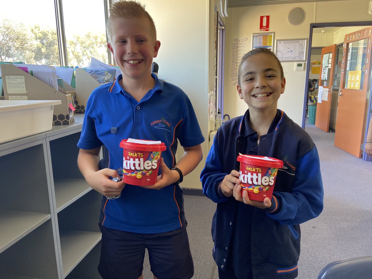 MsOfficerACPS's tweet photo. 6A’s two skittle Kings.  All students collected skittle points during lockdown and the two students who achieved 80 skittle points got their skittles bucket today.  @AitkenCreekPS https://t.co/EEOtYQTFfM