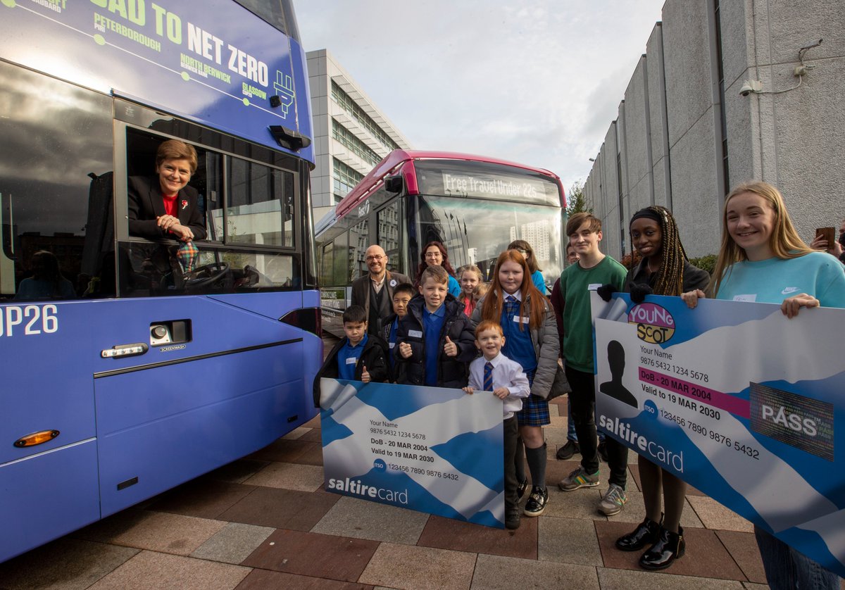 First Minister Nicola Sturgeon and Scottish Government Minister Patrick Harvie join school children to board an electric bus and celebrate free bus travel for Under 22s.