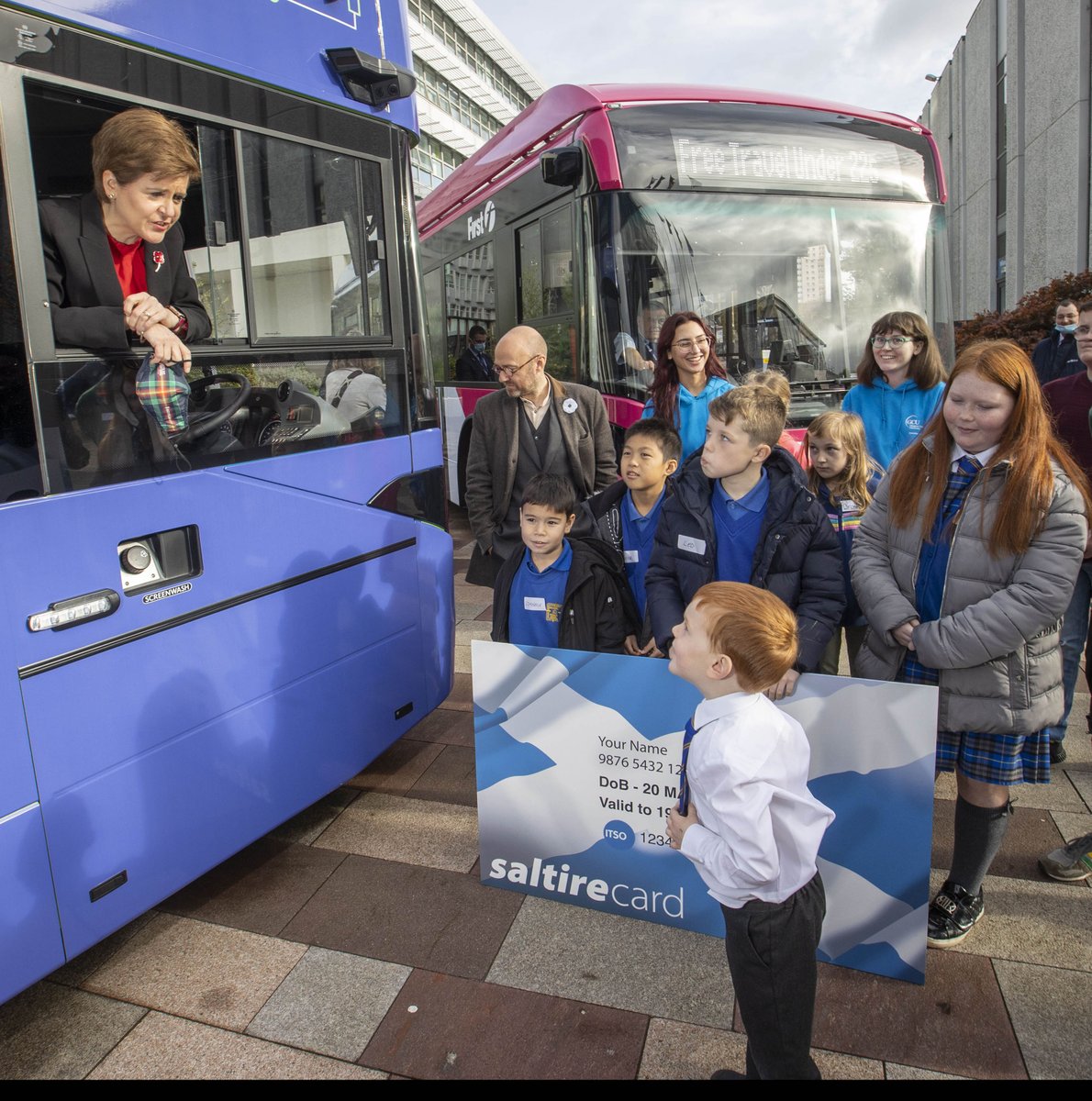 First Minister Nicola Sturgeon and Scottish Government Minister Patrick Harvie join school children to board an electric bus and celebrate free bus travel for Under 22s.