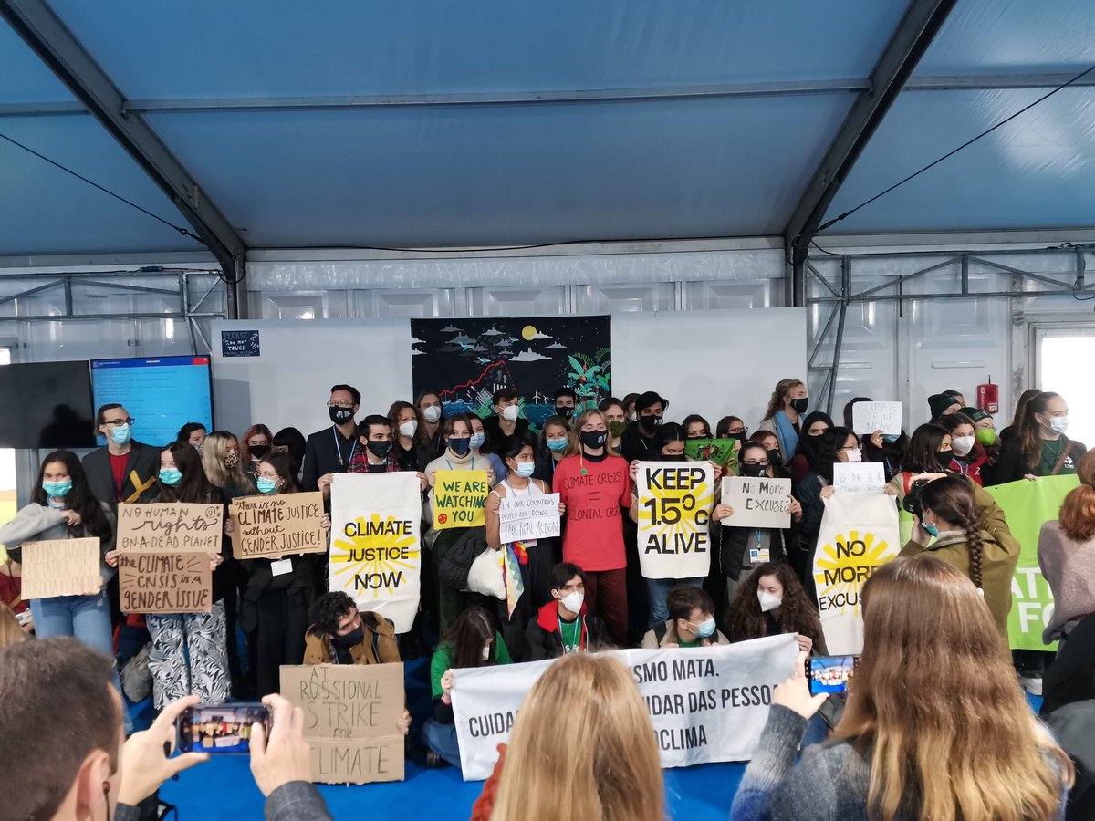 Graeme_F_Smith's tweet photo. Youth climate activists inside #COP26 today for Youth Empowerment day. Making their voices heard! @OpenUniversity #openuni https://t.co/lhqmBPlXrc