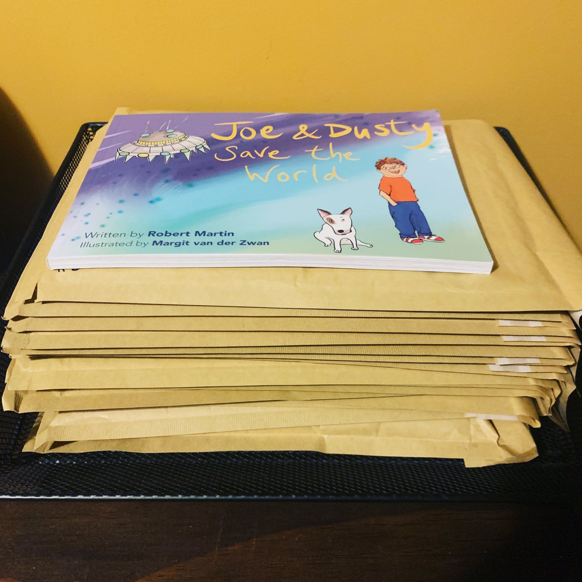 Bobby_Martin's tweet photo. Here's a pile of envelopes just waiting to be filled with the hardback of Joe and Dusty Save the World. Lovely that these are almost all 'kindness bundle' purchases - people buy a copy for themselves and donate another. Spread the love with #joeanddusty https://t.co/Li6rygRxKL https://t.co/bKH0b4mgz0