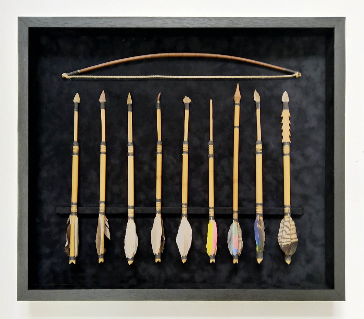 CF_Framing's tweet image. A customer brought this bow &amp;amp; arrows back from a holiday, we think, in the Amazon. The arrows were lifted to show the feather flights and were wired in using thin fuse wire. This could possibly be a first for us 🤔 #souvenir #travelmemorabilia #holidaymemorabilia #framing