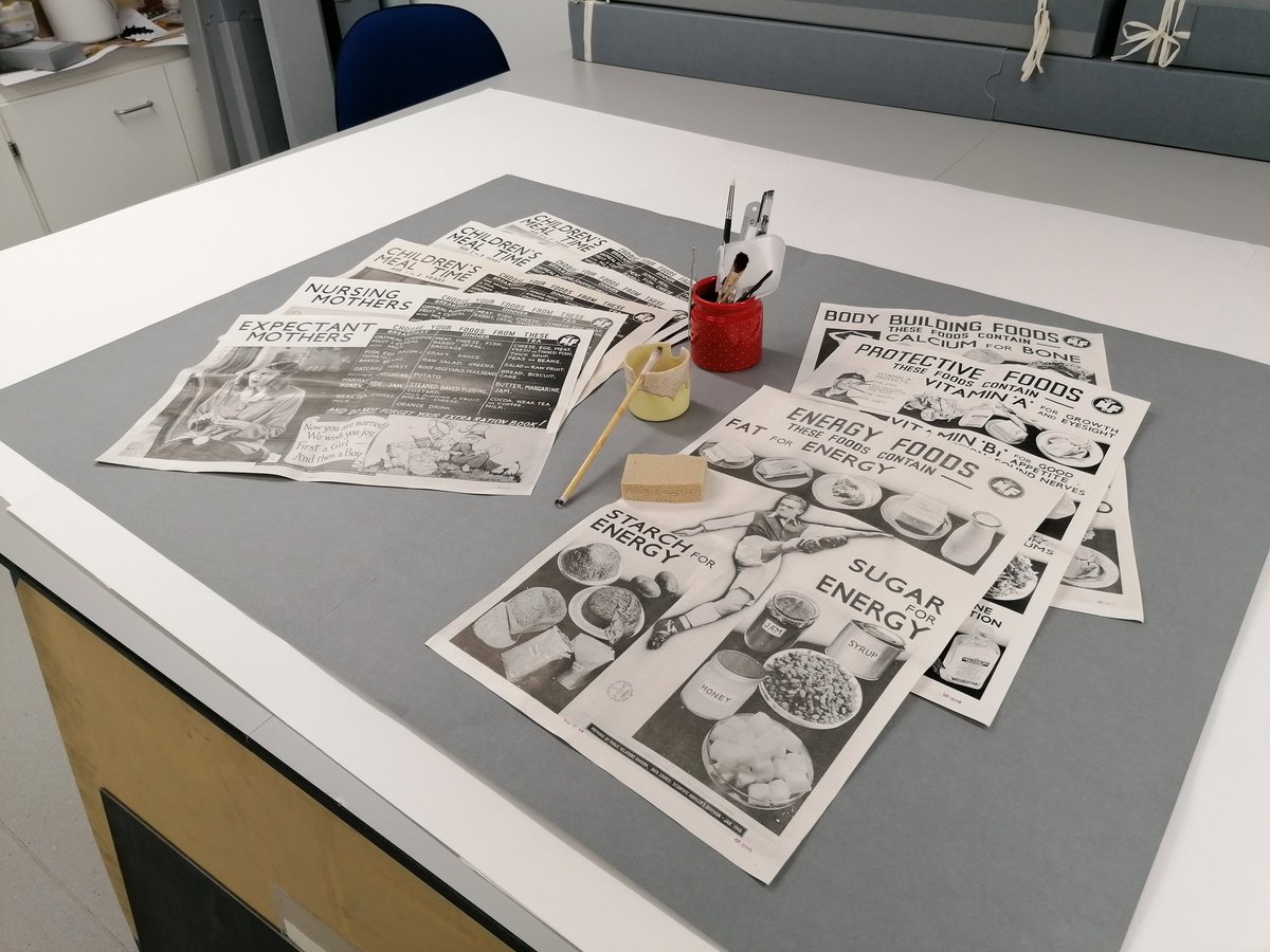NLSColl_Care's tweet photo. @nlsmodern @natlibscot @Arsenal Our mystery footballer is about to undergo some 'physio' in the conservation workshop! Alongside are his 'team mates', a selection of posters from the Ministry of Food, published c1948. Treatment will include surface cleaning, tear repair, crease reduction &amp; rehousing. https://t.co/l8gQQkwHS8