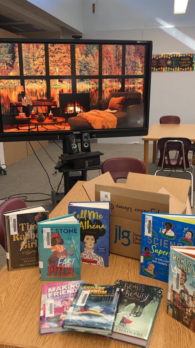 Liv_Luv_Library's tweet photo. Fantastic Friday indeed! Fall fireplace scenes at the library and my @JrLibraryGuild box of new titles to highlight! #newbooksmell #fireplacescenes #fallatthelibrary https://t.co/pSGJceqshh