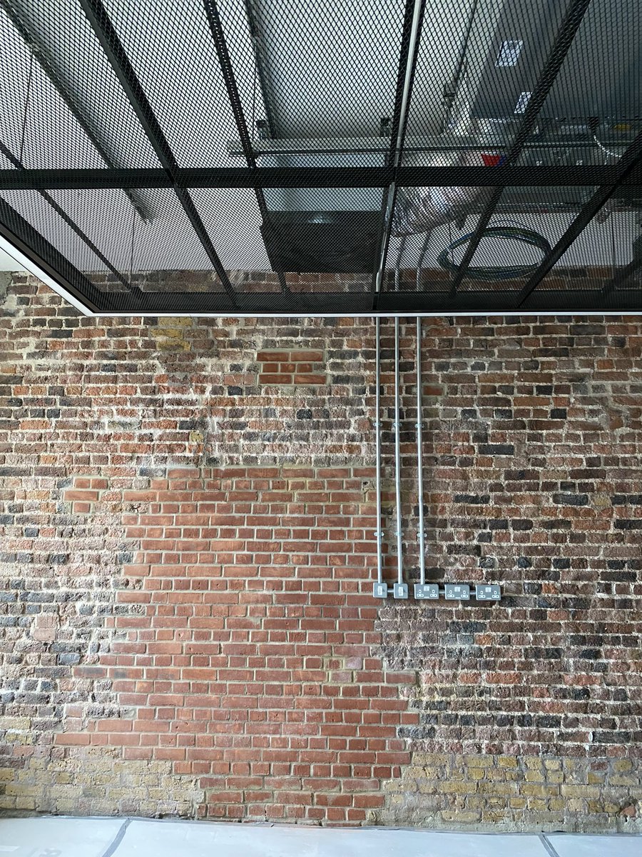 PeterMarsh_PMC's tweet photo. ⁦@TowerHamletsNow⁩ New Town Hall progress photos - stairwell glazing, exposed brick office walls, waffle slab in the council chamber, and the central atrium space ⁦@AHMMArchitects⁩ ⁦@turnertownsend⁩ ⁦@BouyguesUK⁩ #creatingspaces #clientteam https://t.co/QGTVB0lrmh