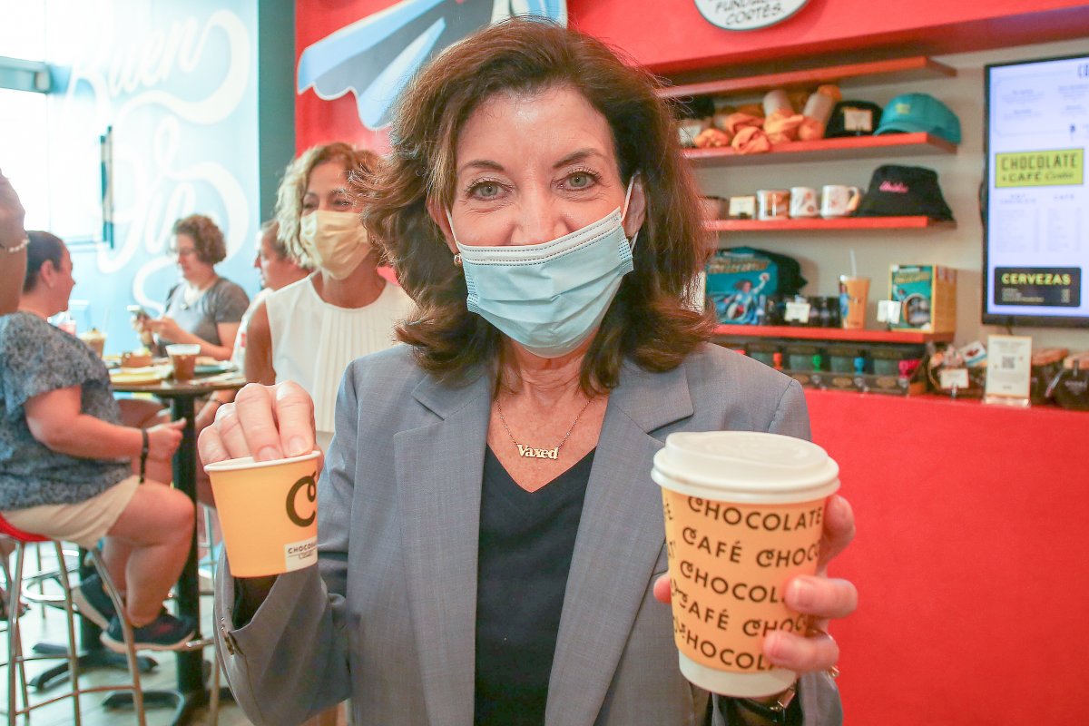 Governor Hochul holds two cups of hot chocolate