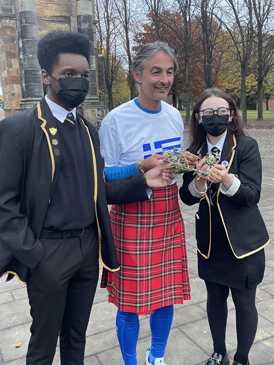 StMungosAcademy's tweet photo. Today our S6 students represented the young people of Glasgow by meeting Agis Emmanouil at the end of his 2421 mile run from Athens to Glasgow for COP26. Congratulations Agis and the warmest welcomefrom the young people of Glasgow! #OurDearGreenPlace #COP26 #2421ClimateRun https://t.co/BxFl5zTed4