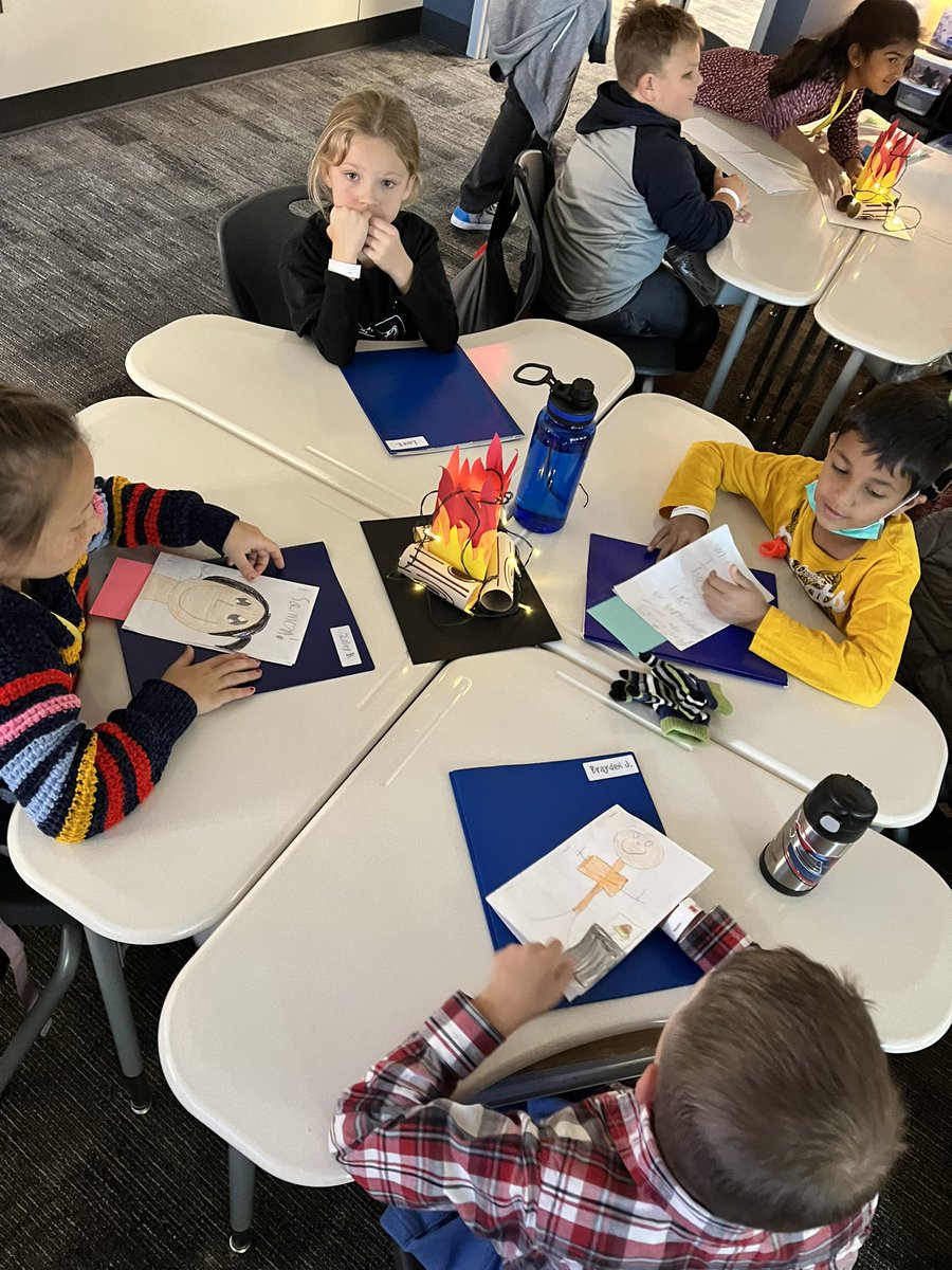 MrsRedner's tweet photo. We had so much fun celebrating our writing at @rennellredhawks with a camp-in! Kids thought it was fun to warm their hands on the tabletop bonfires! 😂🔥😂 #NotTooClose #WeAreRennell https://t.co/oJ0QhQzthD